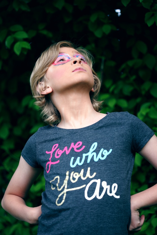 Image of a young girl wearing a love who you are t-shirt